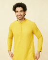 alt message - Manyavar Men Candlelight Yellow Floral Patterned Sequined Chikankari Kurta Set image number 0